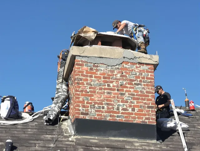 Monroe Chimney Sweep installing a custom chimney crown in Monroe, CT