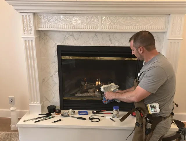 Monroe Chimney Sweep performing fireplace maintenance in Monroe, CT