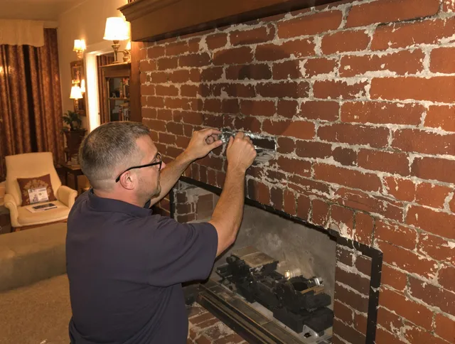 Monroe Chimney Sweep expert fixing a fireplace in Monroe, CT